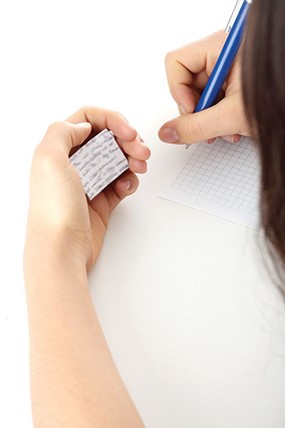 Girl writing on graph paper