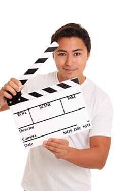 Man holding clapperboard