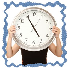 Person holding clock