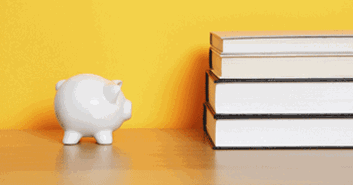 Piggy bank and books